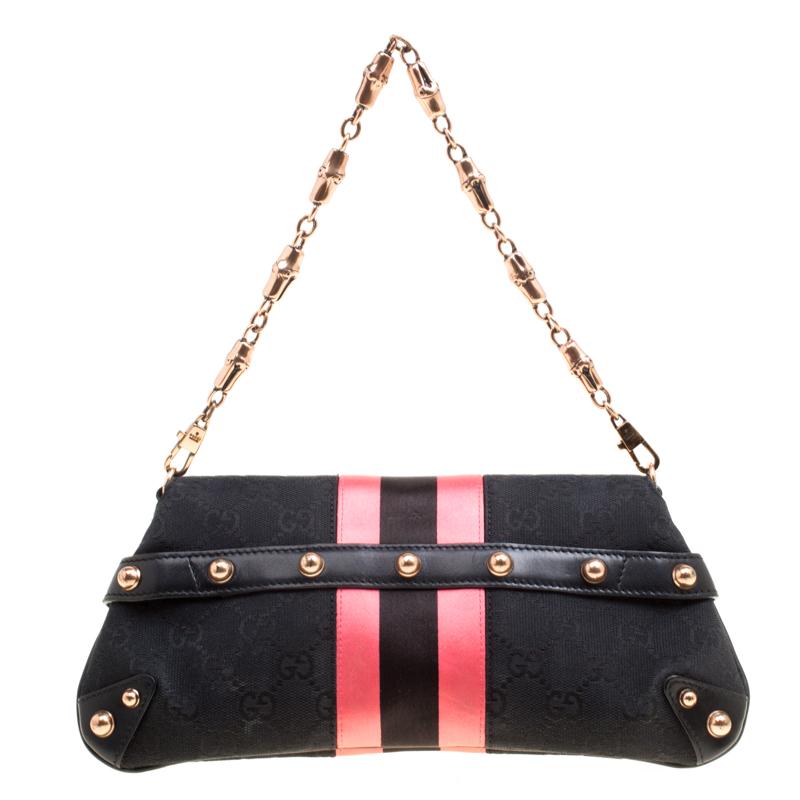 One look at this clutch from Gucci and you will know right away why it is luxury. Crafted from classic GG canvas and styled with pink satin trims, this piece is held by a chain with bamboo accents. The front features their Horsebit accent and it