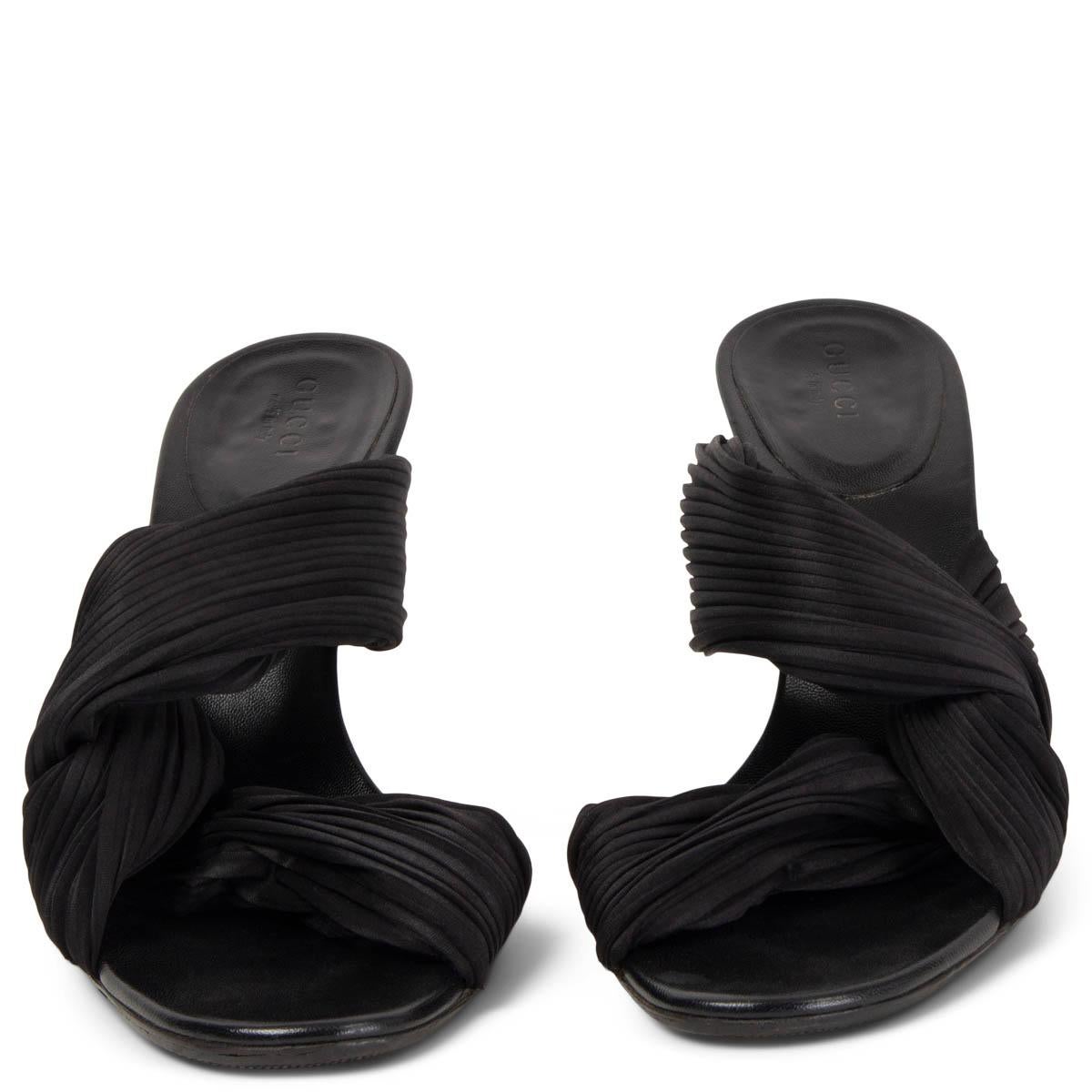 100% authentic Gucci by Tom Ford pleated satin strap sandals in black fabric and leather. Have been worn and show some minimal signs of wear. Overall in excellent condition. Rubber soles got added.

Measurements
Imprinted Size	38.5
Shoe