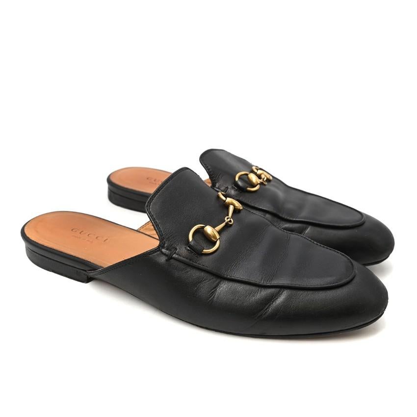  Gucci Black Princeton Horsebit Leather Backless Loafer

- Cult Princeton shape
- Features signature Gucci gold-tone horsebit
- Backless slip-on style
- Almond toe
- Low stacked heel

Materials:
Leather

Made in Italy

Please note, these items are