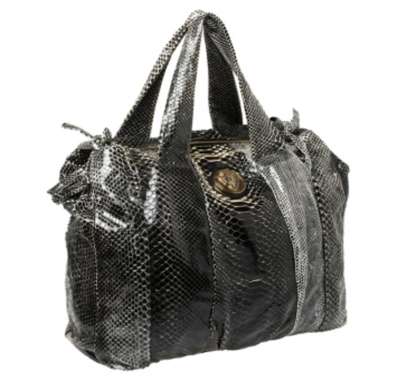 The Hysteria is one of Gucci's most loved bags for women. Crafted from python leather, it has a gorgeous exterior and two handles for you to easily parade it. The nylon interior is spacious and the bag is complete with the signature emblem in gold