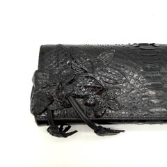Gucci 1990s Black Python Leather Tassel Clutch with Floral Appliqué