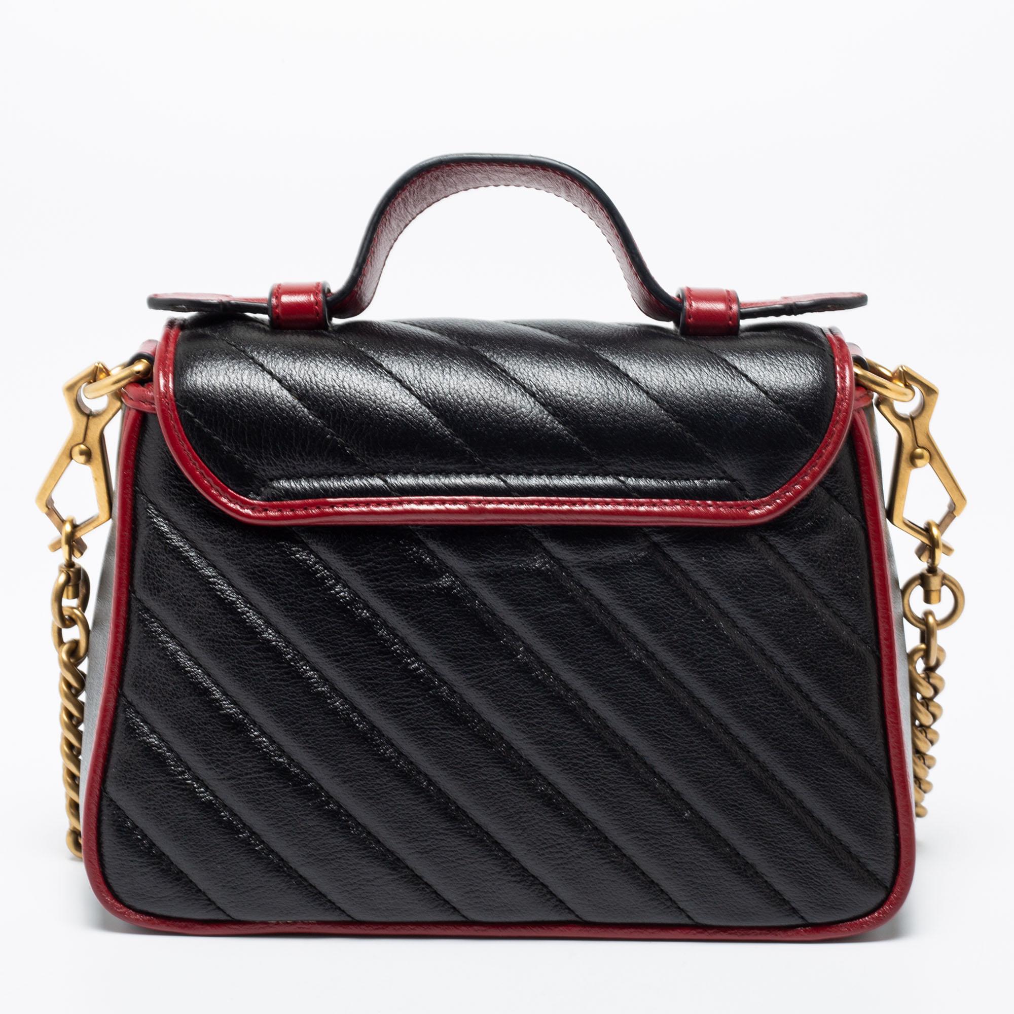Infused with classic elements and exquisite craftsmanship, this Gucci bag signifies timeless elegance. The red trimming against the black exterior and gold-tone accents lend it an elevated appeal. Made from matelassé leather, it can be carried