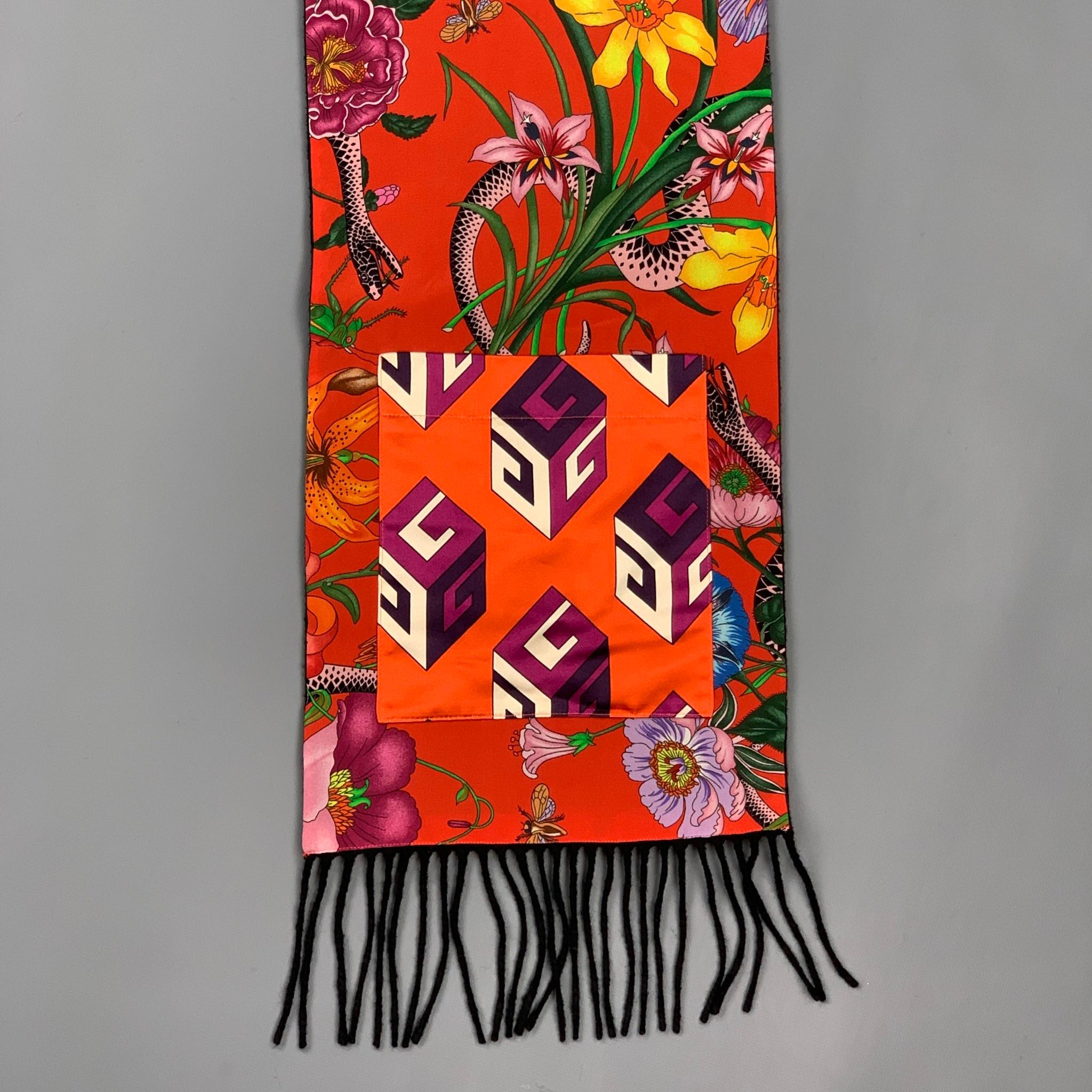 GUCCI scarf comes in a black & red floral silk / cashmere featuring a reversible style, pocket details, and a fringe trim. 

Very Good Pre-Owned Condition.

Measurements:

9 in. x 86 in. 