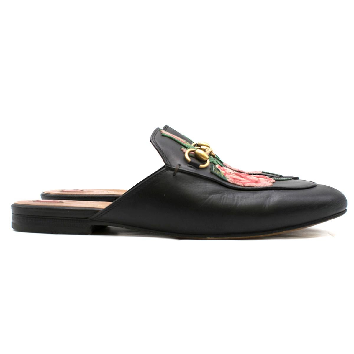 Gucci Black Rose Embroidered Princetown Slippers

- Black leather slippers
- Thread embroidered roses 
- Horsebit detail
- Elongated toe
- Leather sole

Please note, these items are pre-owned and may show some signs of storage, even when unworn and