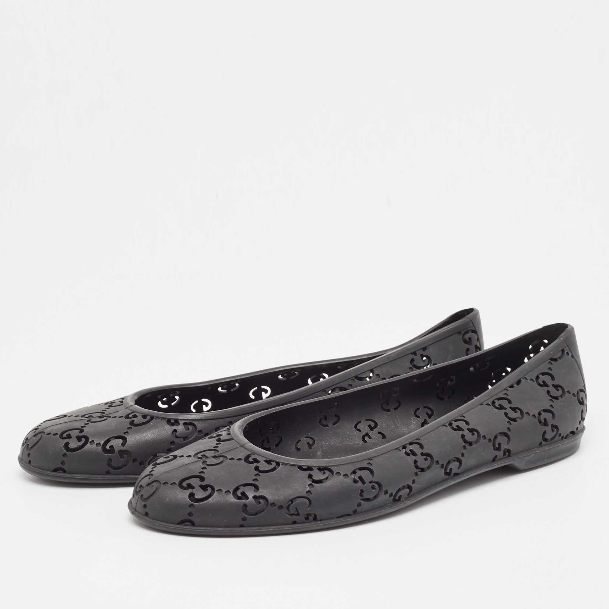 Chic and cool, these ballet flats from Gucci are crafted with a rubber body detailed with black 'GG' web detailing on it. This pair features a durable interior and looks equally flattering with dresses and trousers.

