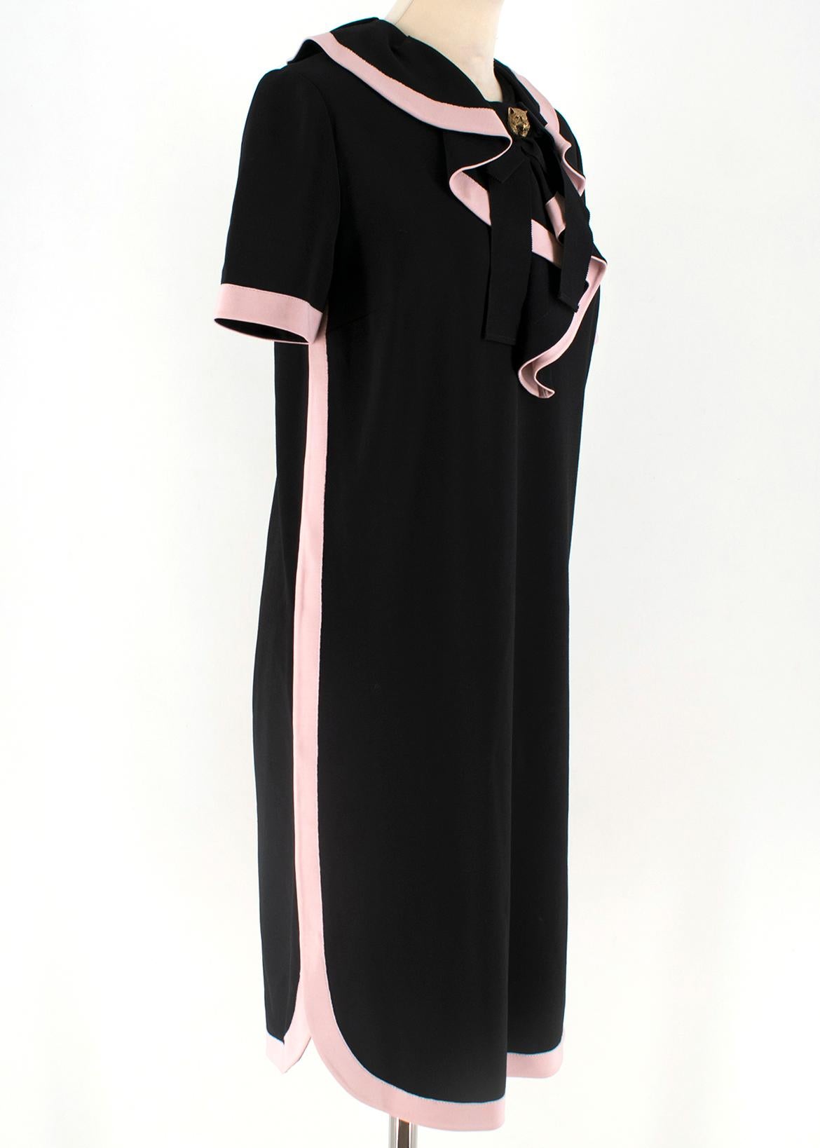 Gucci Front Ruffle Black and Pink Dress 

-Front ribbon with Gucci tiger detail 
-Baby pink color cuff, color  
-Ruffle front 
-Back zip(Good condition)
-Half sleeve
-Rounded side slits 

Please note, these items are pre-owned and may show signs of