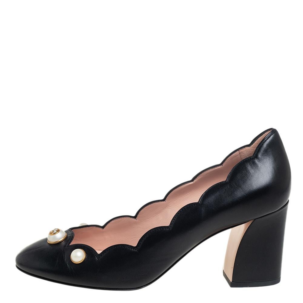 Obtain a unique outlook in the crowd by befriending this pair of Gucci pumps. From its scalloped leather and beautiful pearl embellishment on the front, every feature is perfectly put in to make it look unique. The block heels add both comfort and