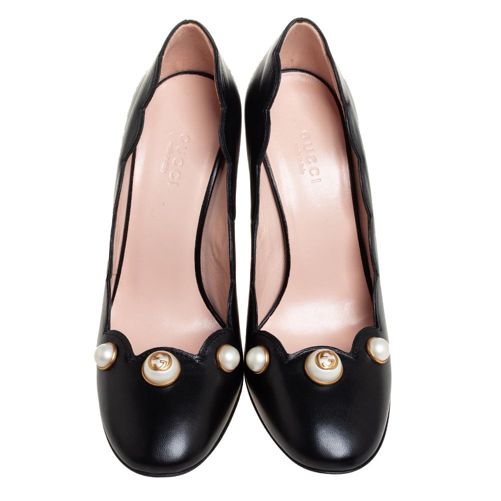 This pair of Gucci pumps are stylish, elegant, and modern. From its scalloped details and beautiful pearl embellishment on the front, every feature is perfectly put in to make them look unique. The block heels add both comfort and style to your