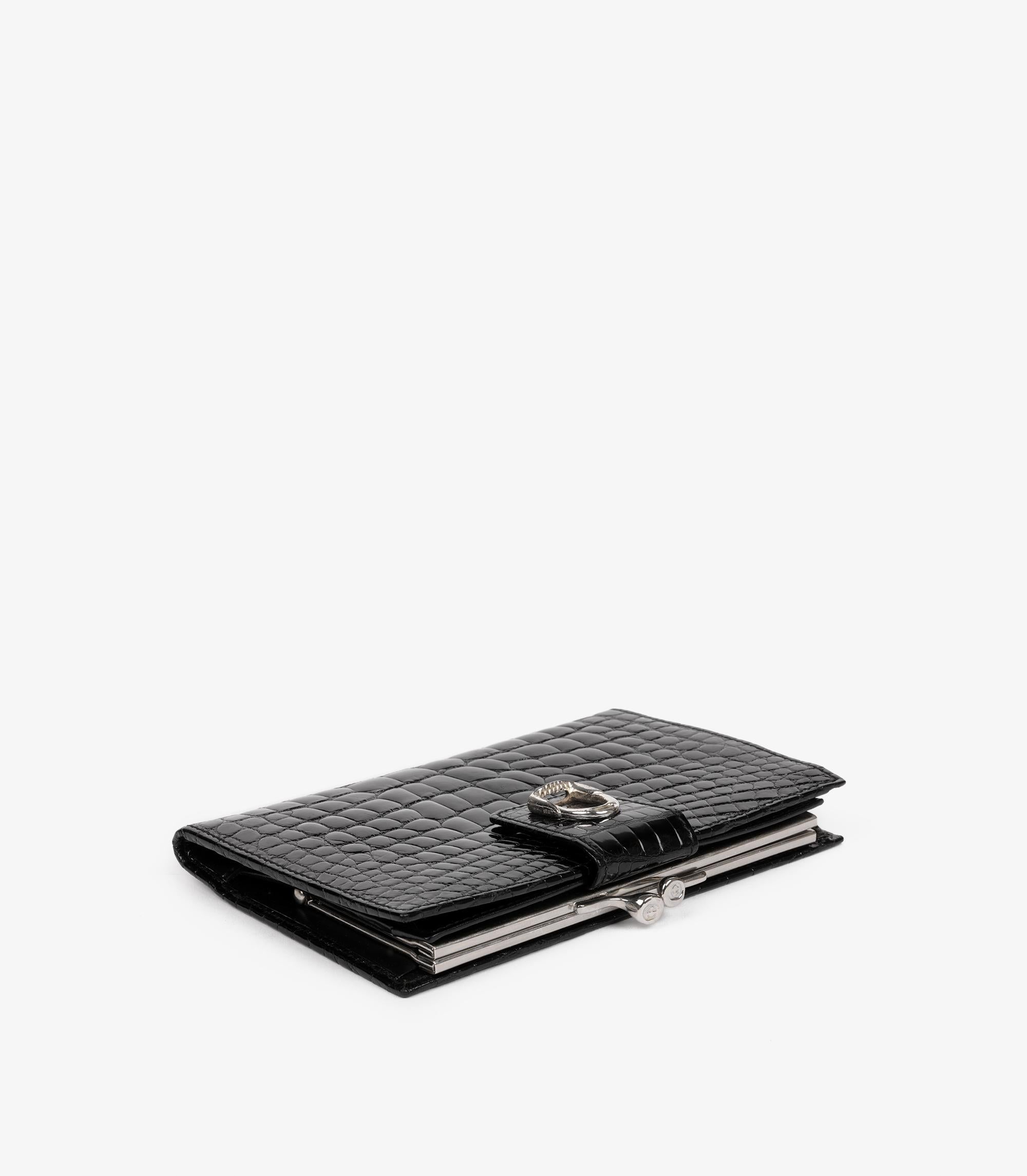 Gucci Black Shiny Alligator Leather Vintage Stirrup Wallet

Product Details
Xupes Ref: CAA0106
Brand: Gucci
Model: Stirrup Wallet
Type: Wallet
Serial Number: 035-001-0821-432
Colour: Black 
Hardware: Silver 
Material(s): Shiny Alligator