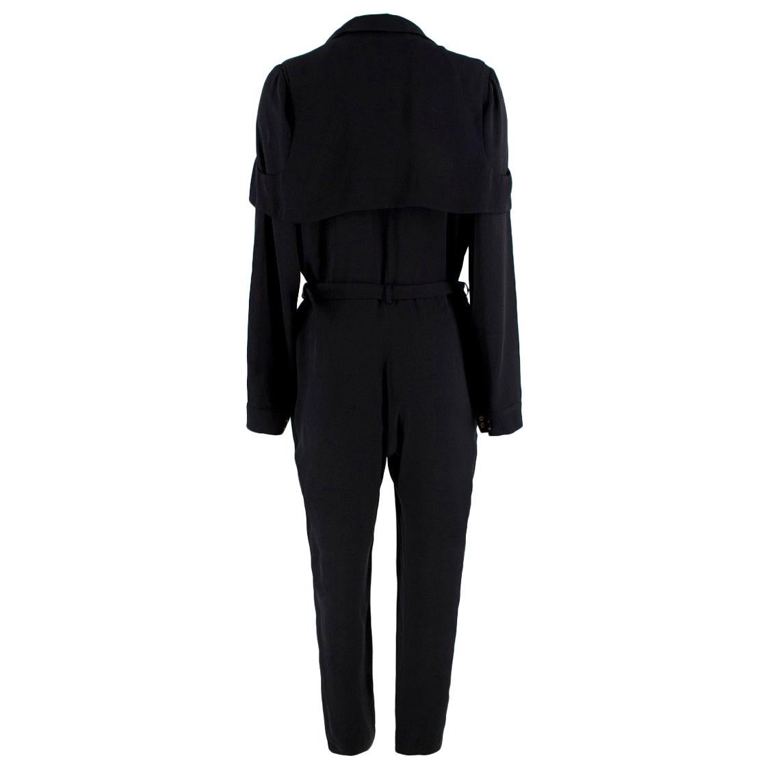 Gucci black silk-blend jumpsuit

- Black, lightweight silk-blend satin 
- Notch lapels, long sleeves, pleated cuffs
- Straight legs, slanted welt pockets  
- Wrap design
- Black trench-effect storm flap overlay 

Please note, these items are