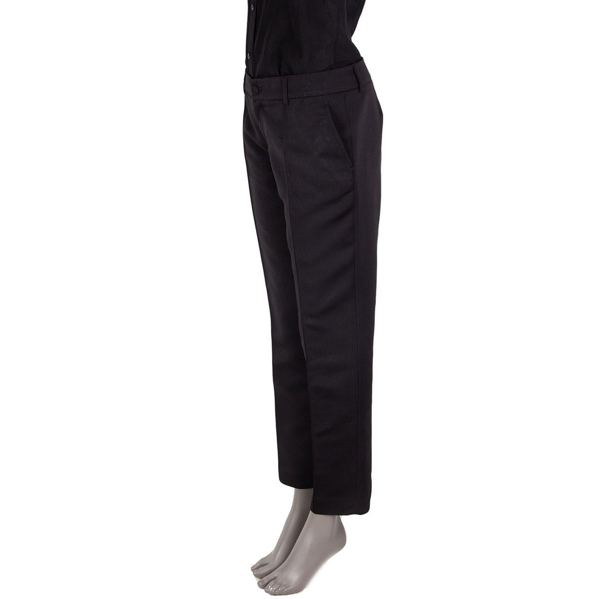 100% authentique Pantalon classique Gucci en soie noire (64%) et polyamide (36%) avec poches fendues. Se ferme sur le devant par une fermeture à glissière et un bouton. Non doublé. Ils ont été portés et sont en excellent état. 

Mesures
Taille de