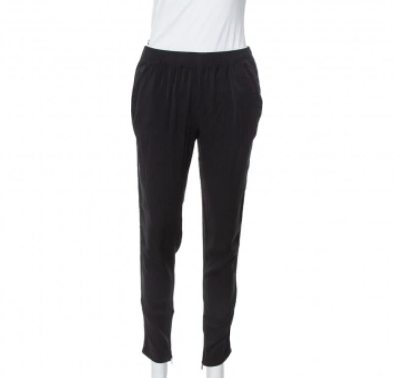 Tailored from black silk, Gucci's trousers are designed for a great fit. They offer a comfortable elasticized waist and two pockets. We like to wear ours with a casual top or a t-shirt and statement shoes.