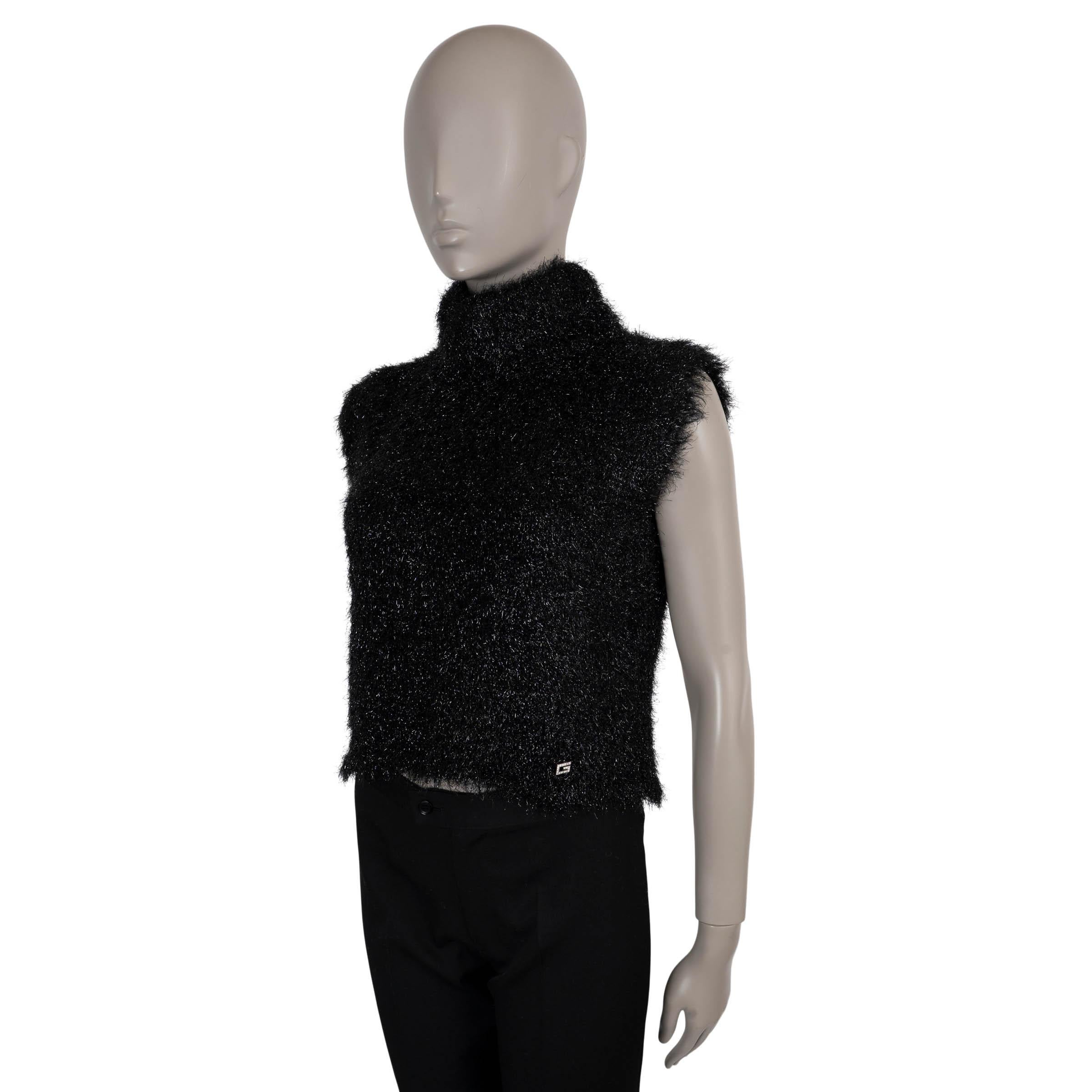 This 100% authentic Gucci sweater vest is crafted in black fuzzy knit made from nylon (58%) and polyester (42% - please note the content and size tag are missing)with silver and blue lurex accents throughout. It features a cropped silhouette with a