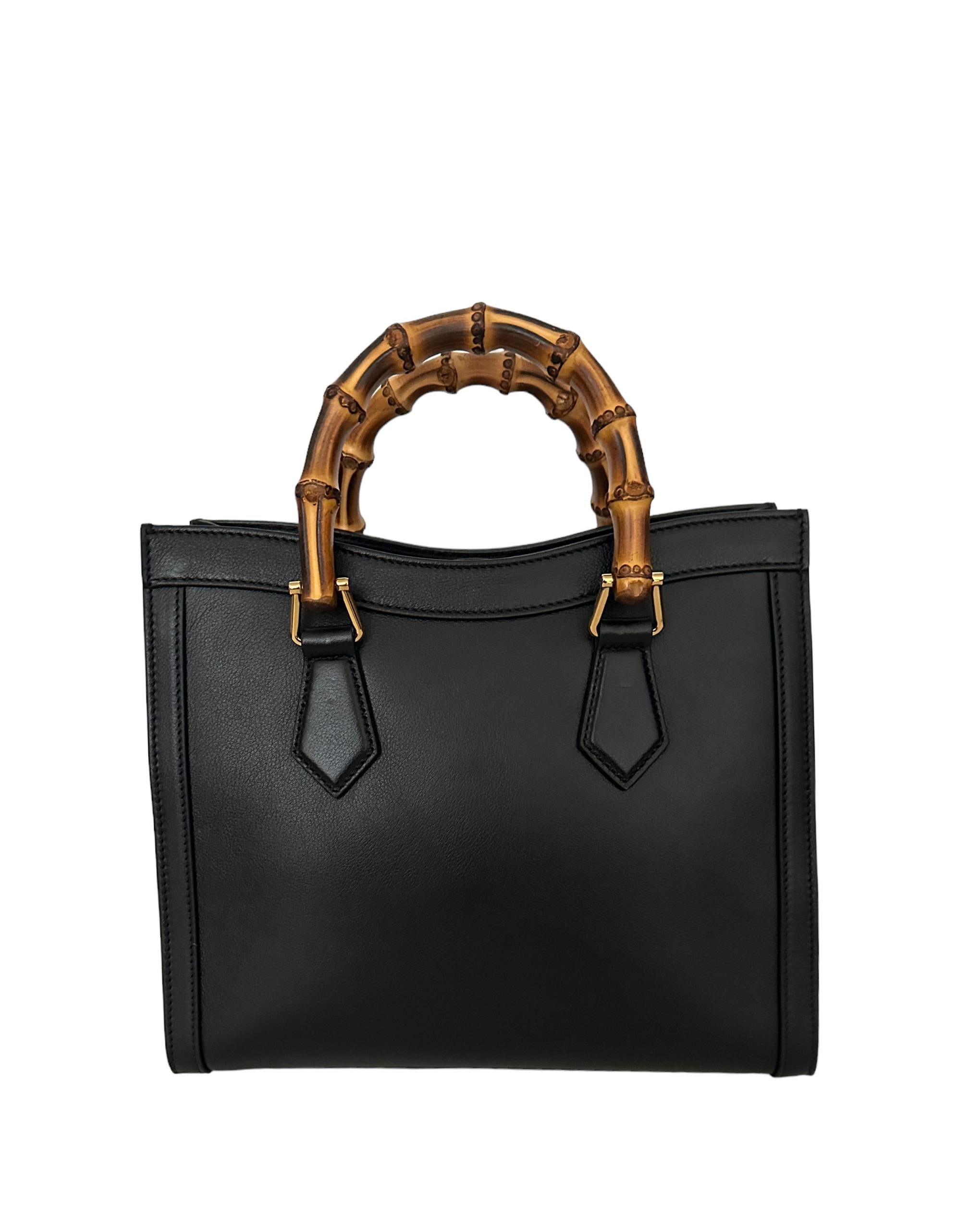Gucci Black Small Calfskin Leather Diana Bamboo Bag w/ Strap

Made In: Italy
Color: Black
Hardware: Goldtone
Materials: Calfskin leather
Lining: Microfiber lining with a suede-like finish
Closure/Opening: Center tab with magnet
Interior Pockets: One