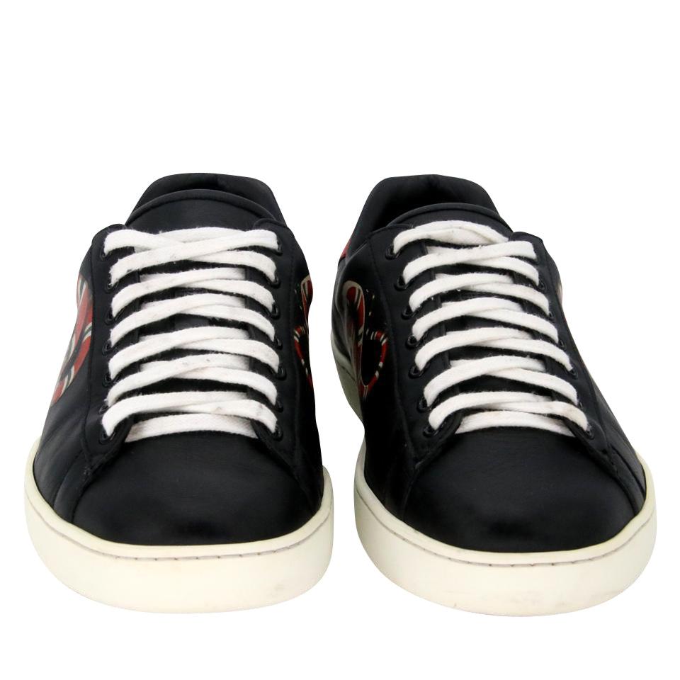 Gucci Black Snake Runway Low Top Sneakers

Here is another rare GEM by the world famous Gucci House. Decorated with the brand's signature striped webbing and a snake motif, these tennis sneakers could only be Gucci. This Italian-made pair is crafted