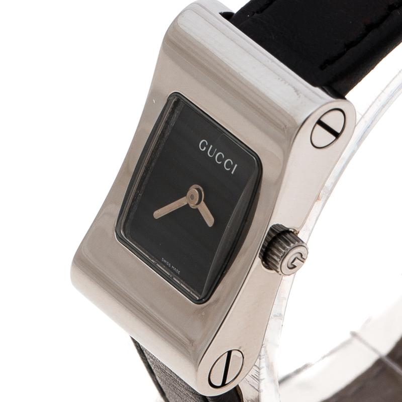 This wristwatch by Gucci will lend a smart and elegant accent to your formal attire. Made from stainless steel, it features a smooth bezel that profiles a black dial. This watch houses two hands and the brand label. The black leather bracelet comes