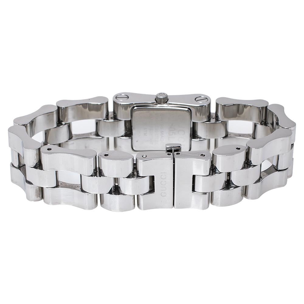 This stainless steel watch from Gucci is a fine blend of an elegant shape with harmonious design. The 2305L watch has a smooth finish and a simple clasp. The black dial is set with the brand name and two hands.

Includes: 1 Extra Link