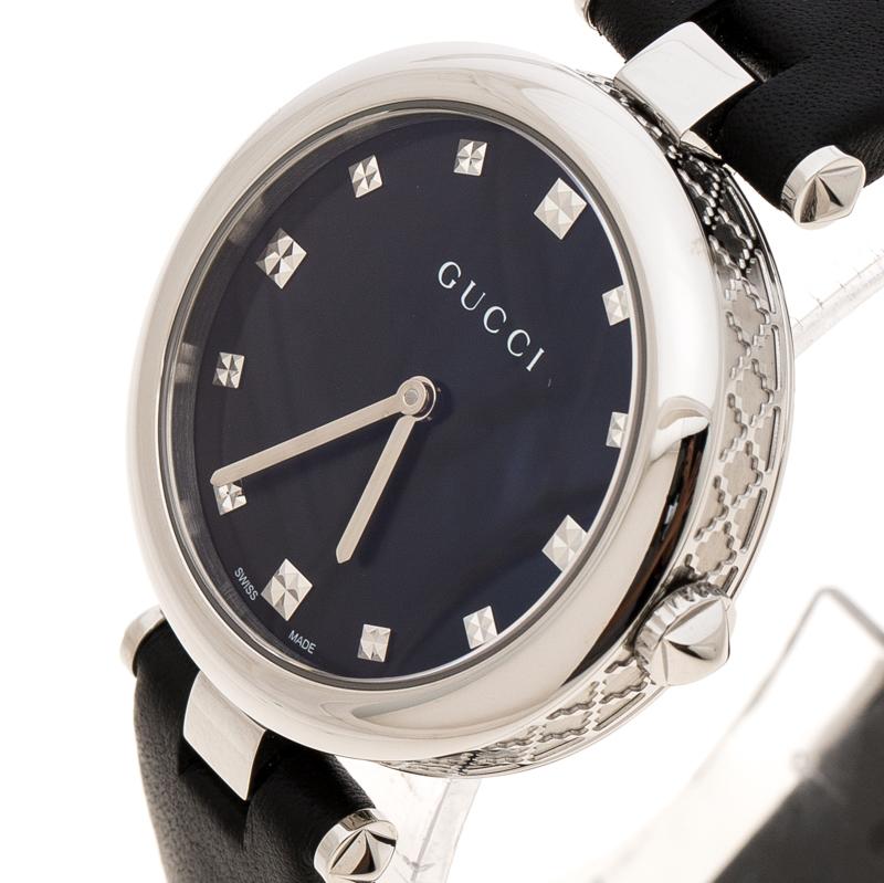 A minimalist style combines with supreme craftsmanship to make this Diamantissima wristwatch from Gucci. A beholding design comprising of a stainless steel textured case of diameter 32 mm, blue dial secured by scratch-resistant, sapphire crystal.