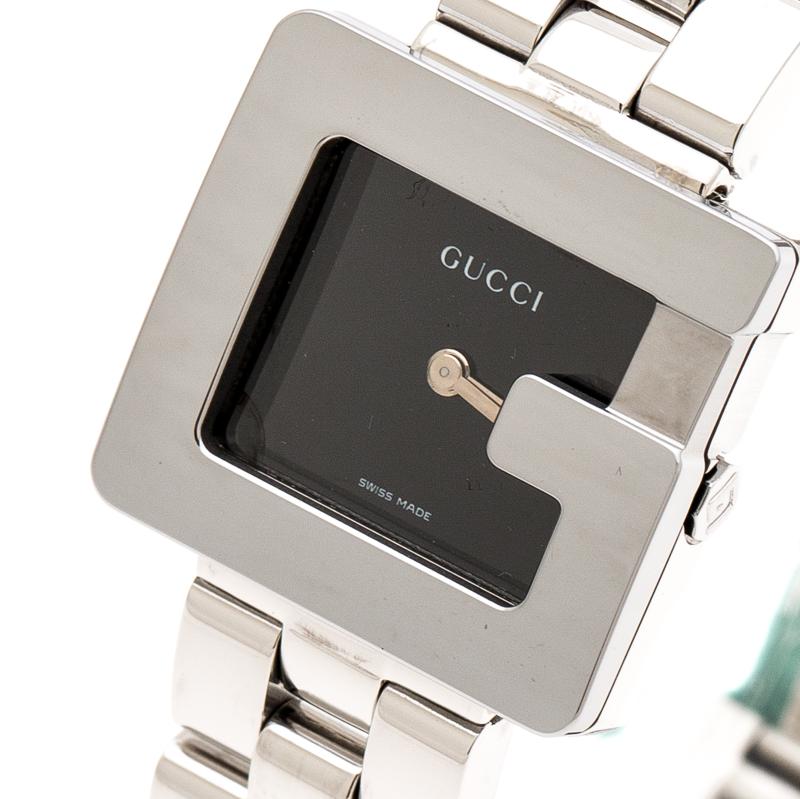 This classy Gucci watch combines beauty and femininity. Its rectangular case features a G-shaped bezel, signifying the brand's initial. The black dial is combined with silver-tone hands and its minimalist style is taken further with the absence of