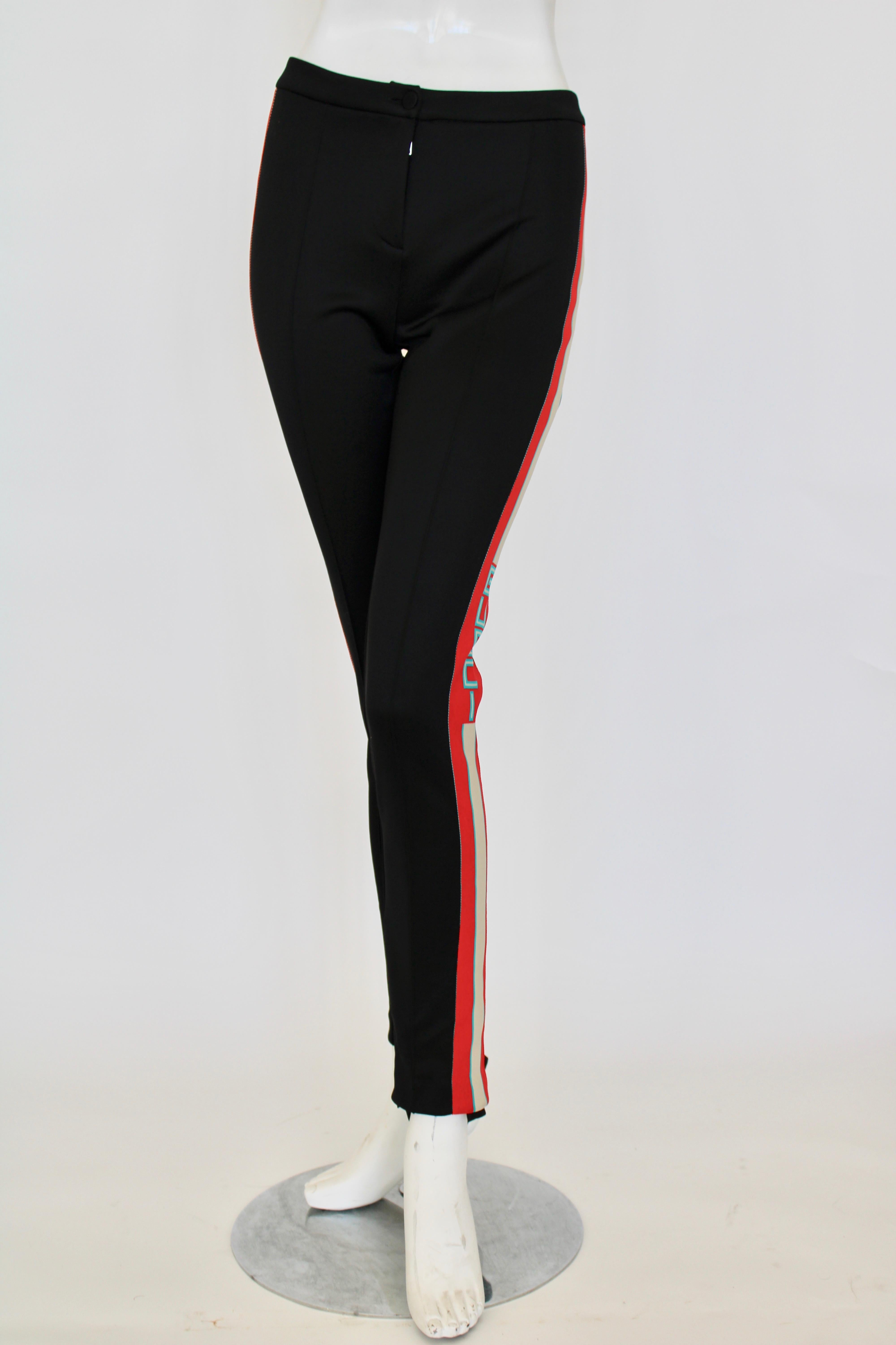 Black stretch stirrup pants with red/cream/green side stripe and 