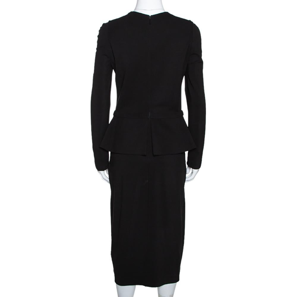 This dress from Gucci has been designed to deliver sophistication and class. It comes in a classic shade of black and features a well-tailored silhouette. It comes with a peplum style, long sleeves, a round neckline and a long zip at the back.

