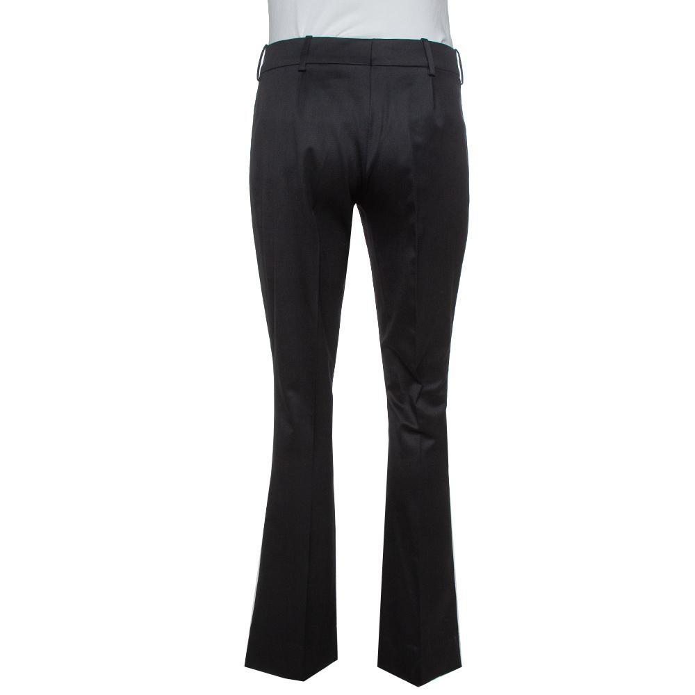 Flared trousers are back in trend and these stylish ones from Gucci will take your fashion quotient a notch higher. Look your best during any formal event wearing these trousers made from a silk blend in a black shade. They are equipped with two