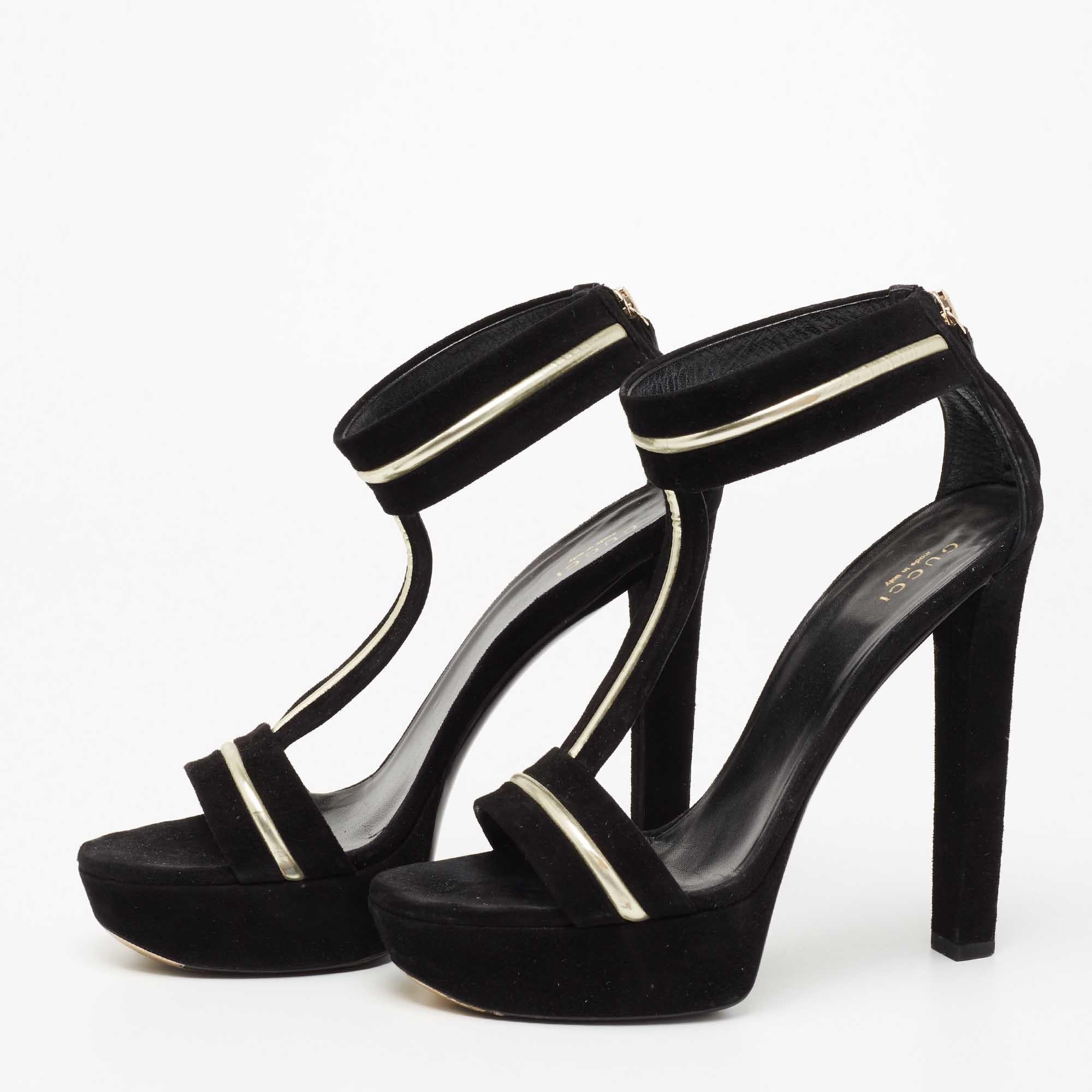 These sandals from the House of Gucci are all about flaunting eternal class and elegance! They are made from black suede and leather on the exterior. They feature open toes, an ankle strap, and tall 14 cm heels. Show off your chic style with these