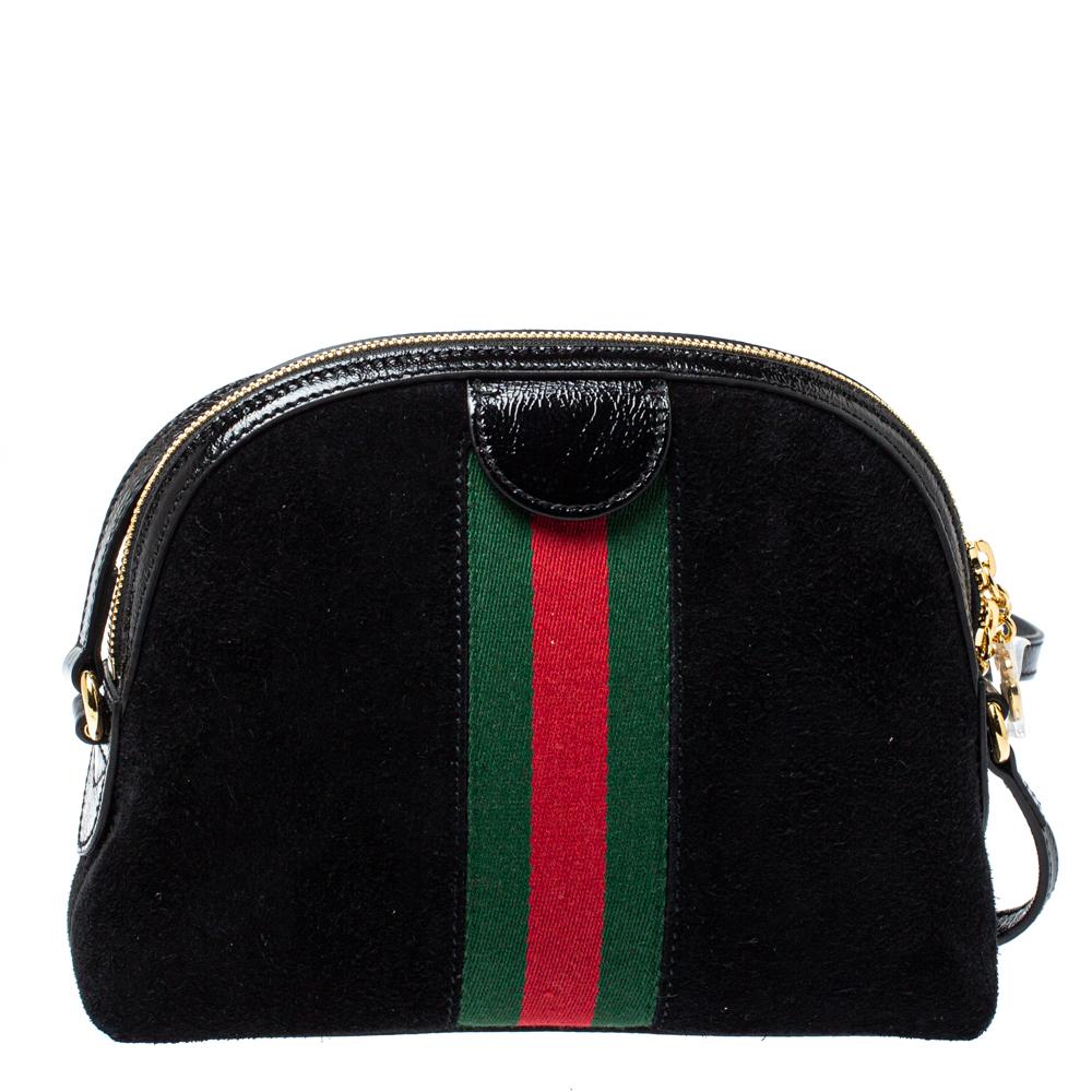 Add to your look by accessorizing with this Gucci bag. Designed expertly, this bag features a suede body that is enhanced with leather trims. The bag flaunts the signature GG on the front and a shoulder strap. It is complete with an interior