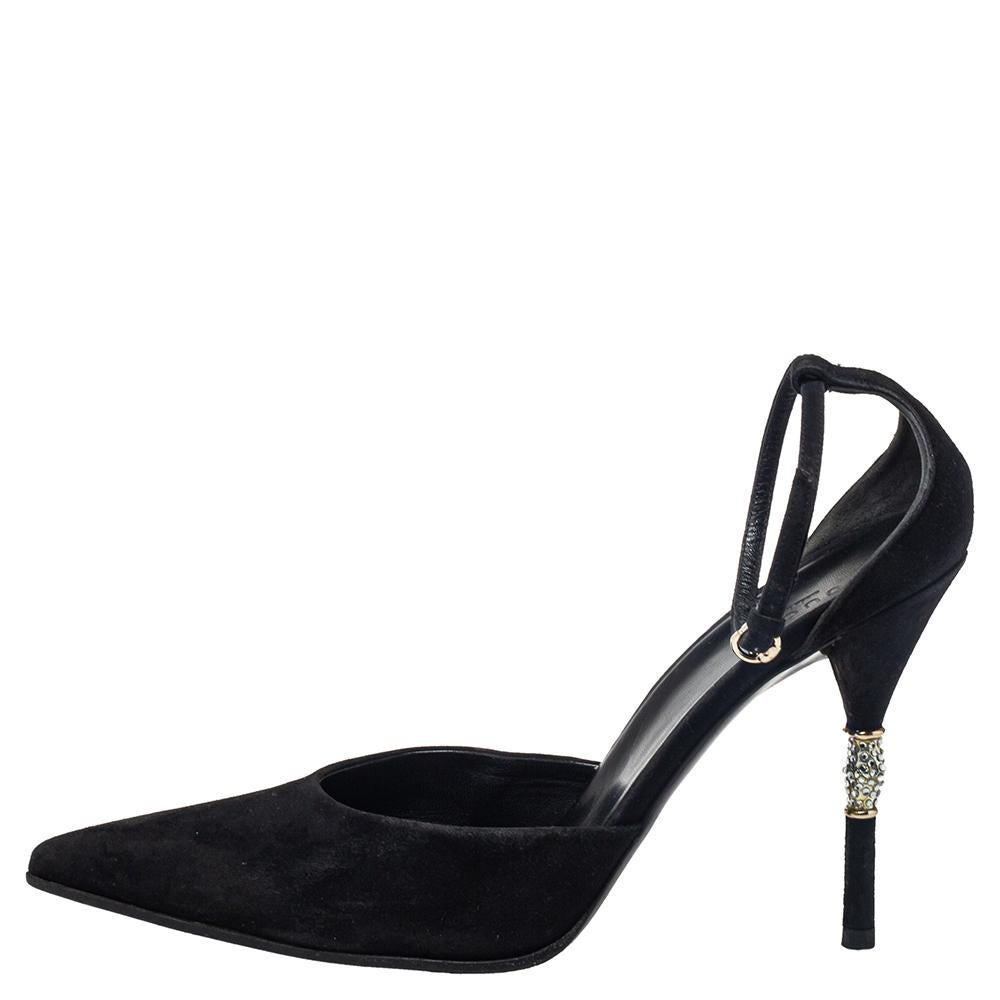 Add a Gucci flair to your outfit with these black pointed-toe sandals. They are crafted from suede and are accented with adjustable sleek ankle straps with pin buckles. They come with 11.5 cm, embellished heels and leather lined insoles with brand