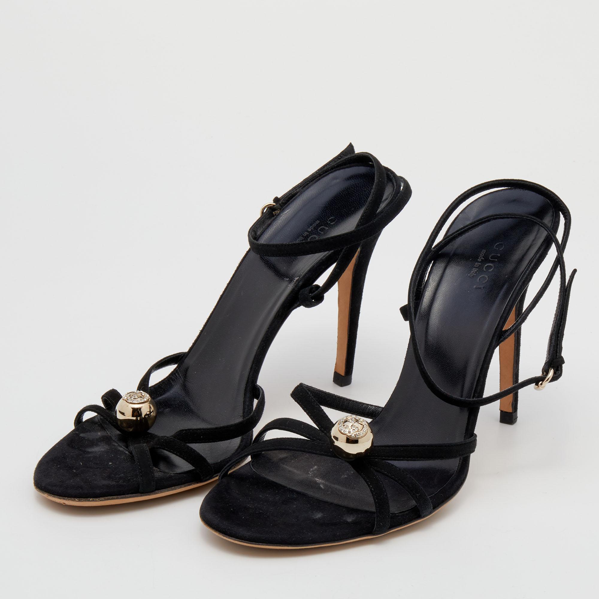 Pamper your feet with these luxuriously designed Gucci sandals. Crafted from suede, they are decorated with a crystal-embellished 'GG' motif on the vamps and feature an ankle buckle closure. The 11cm heels of this pair will fill your day with