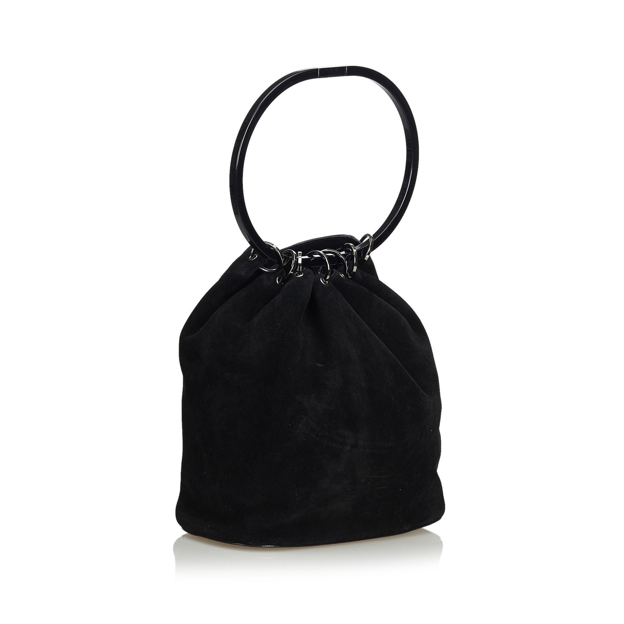 This handbag features a suede body with leather bottom, plastic hoop handle, open top and interior zip pocket. It carries as AB condition rating.

Inclusions: 
This item does not come with inclusions.

Dimensions:
Length: 28.00 cm
Width: 33.00