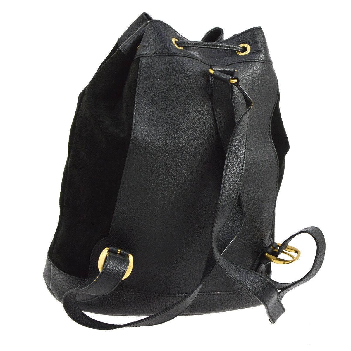 Gucci Black Suede Leather Bamboo 2 in 1 Top Handle Drawstring Shoulder Backpack Bag

Suede
Leather
Bamboo
Gold tone hardware
Woven lining
Made in Italy 
Handle drop 3