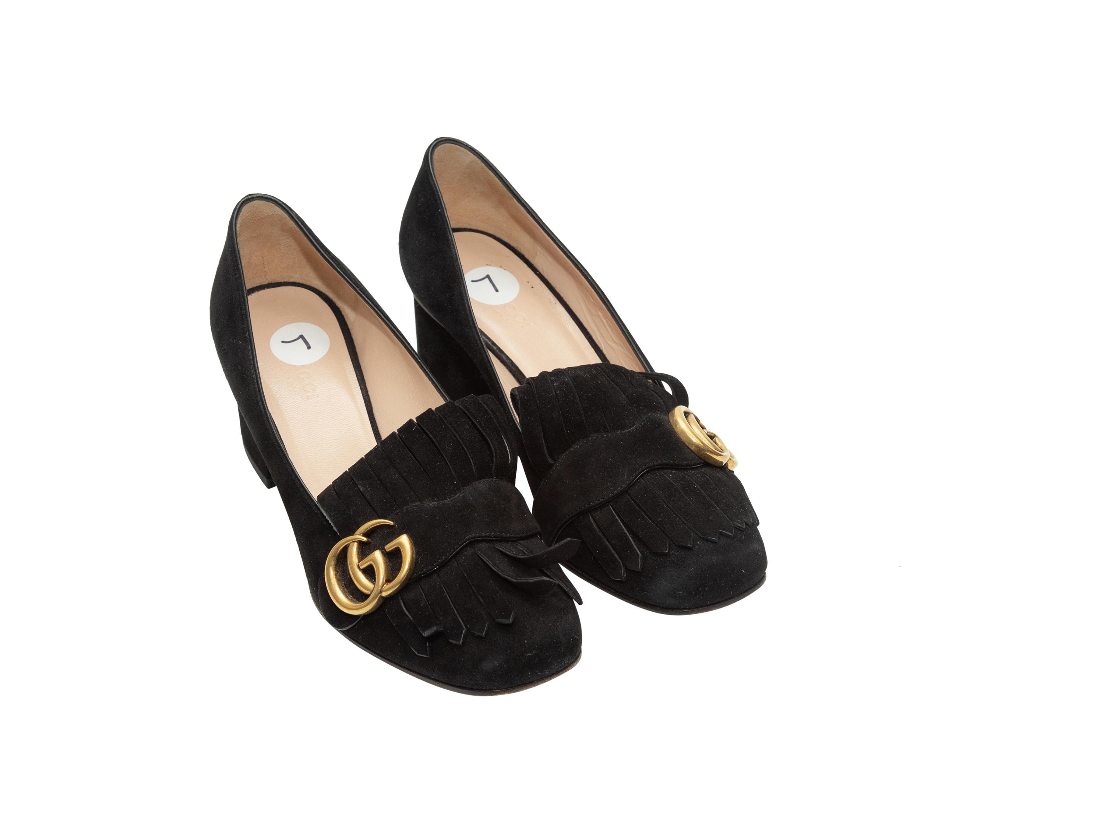 Product details: Black round-toe suede Marmont pumps by Gucci. Kiltie detailing at toes featuring gold-tone GG logo embellishments. Block heels. Designer size 37. 2
