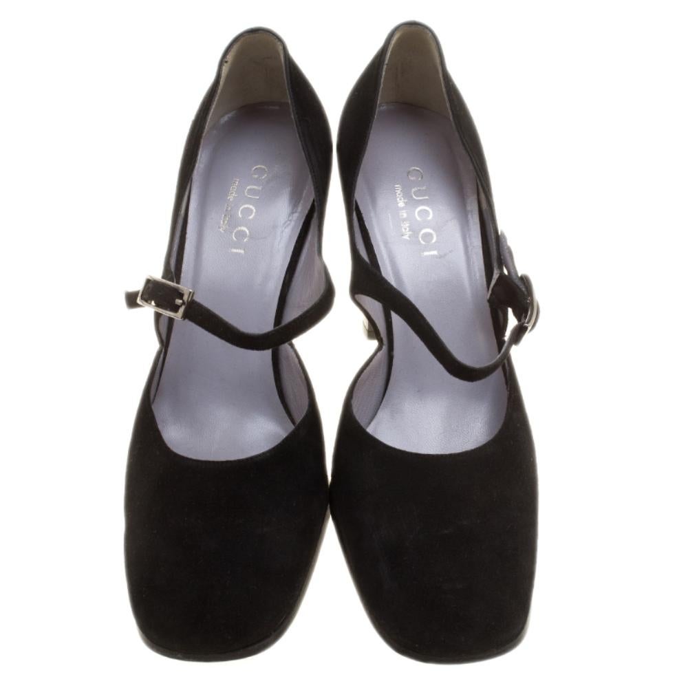 Comfortable, chic yet bold, these Gucci Mary Jane pumps deserves a place in your collection immediately. It features a black suede body and set on tapered block heels. It comes with an ankle strap closure, a square front and secured with a buckle