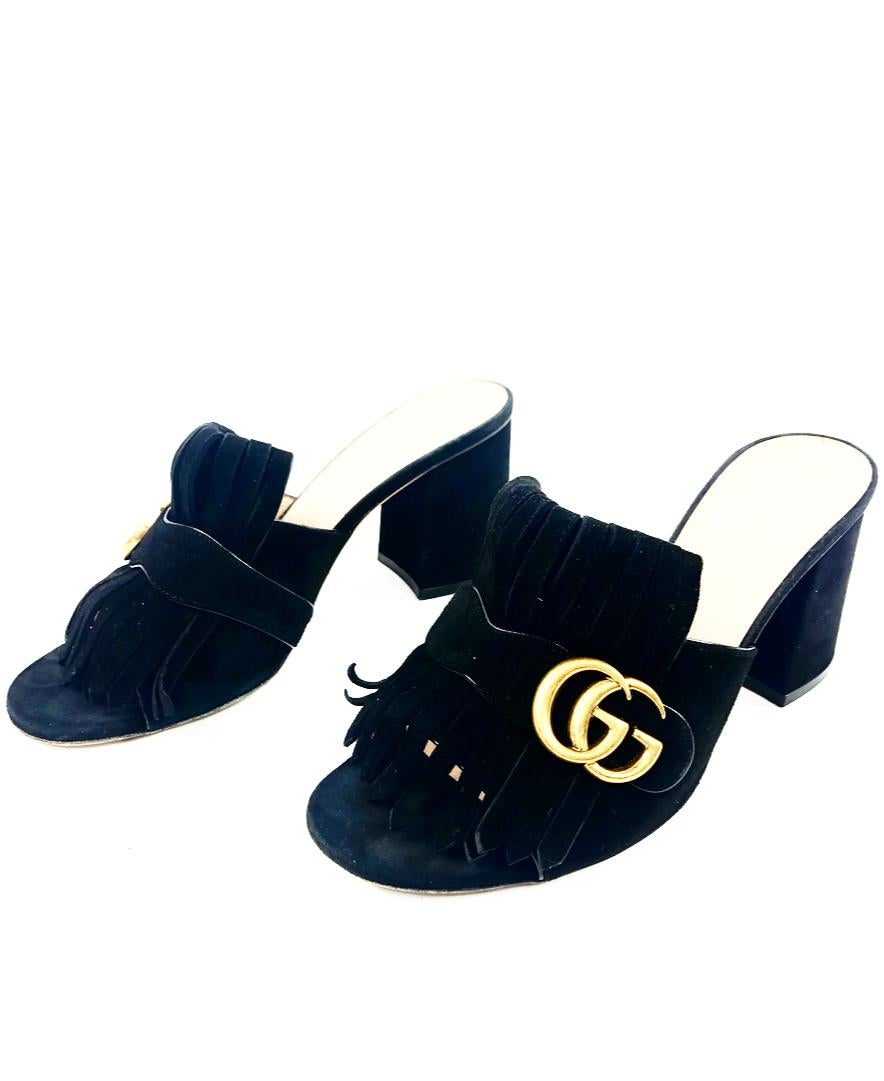 GUCCI Black Suede Mid- Heel Slide Sandals w/ Double G

Product details:
Black suede 
Fold over fringe detail
Double G
3