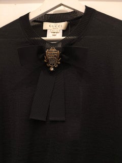 Gucci black sweater with swarovski stone on a bow size M NWOT