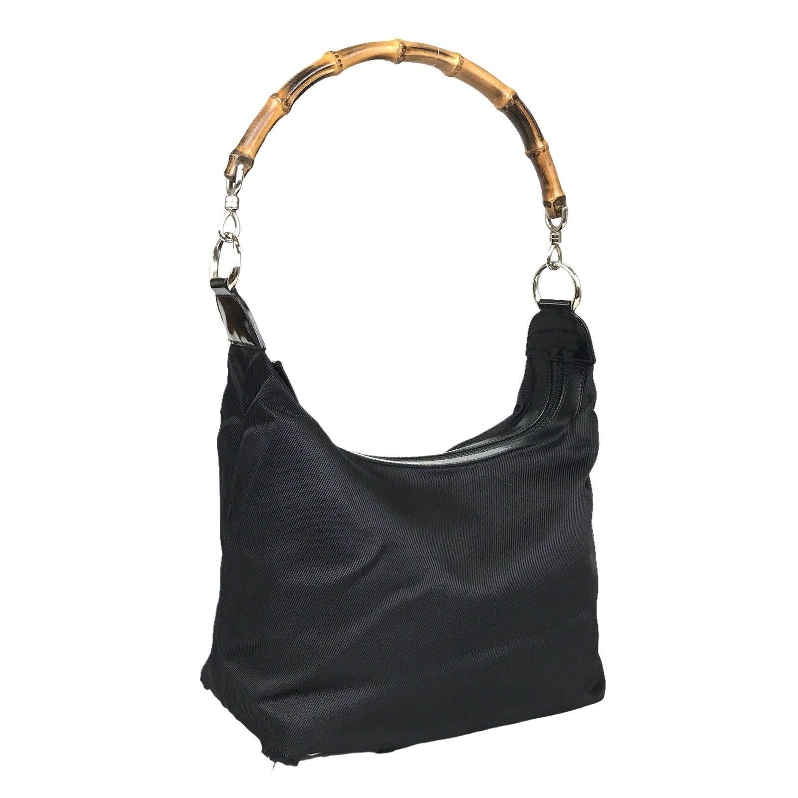Color: Black
Material: Bamboo
Serial code: 
Condition: Good. Bag is very nice with light corner damage.
Made in Italy

Measurements~
Height 7”
Length 10”
Depth 5”
Strap drop: 10”