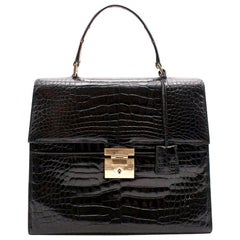 Schwarze Gucci-Tasche mit Griff oben