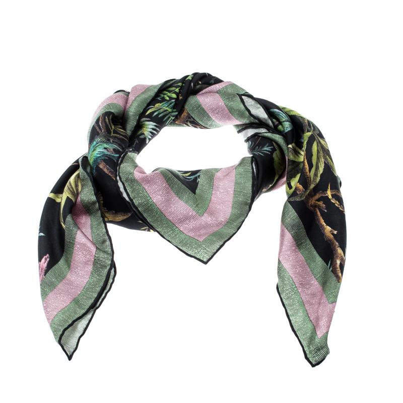 You are bound to impress onlookers with this scarf from Gucci. Luxuriously cut from silk, the black scarf has a gorgeous flora and fauna print all over its square expanse, and every accent on the piece speaks royalty. The scarf is complete with the