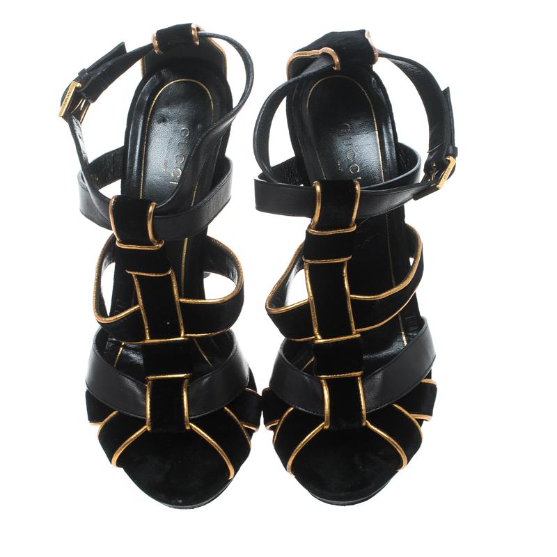 Bold, beautiful and very glamorous, these Malika sandals from Gucci are sure to make your heart skip a beat! The black beauties are crafted from leather and velvet and feature an open toe silhouette. They flaunt intertwined vamp straps and buckled