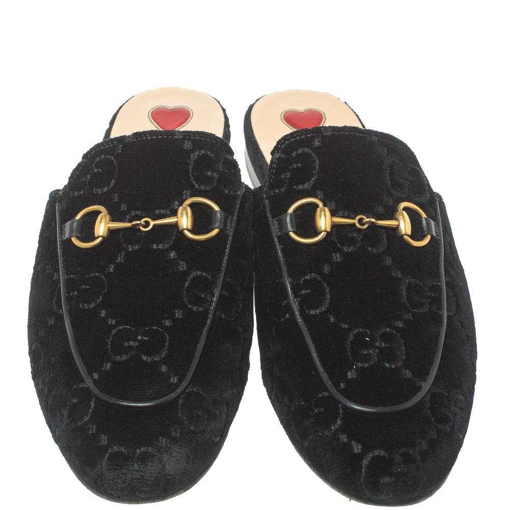 First introduced as part of Gucci's Fall Winter 2015 collection, the Princetown mules are an absolute favorite worldwide and have been worn by countless celebrities. These mules have been designed in black GG velvet and detailed with the signature