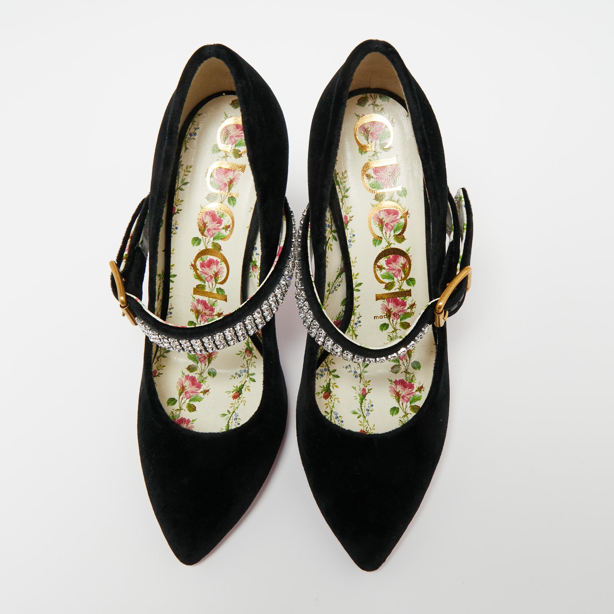 Inspired by the vintage Mary Jane style, these gorgeous pumps from the House of Gucci are going to be your favorite. They are designed luxuriously using black velvet into a sleek silhouette. They exhibit a crystal-embellished strap, gold-tone