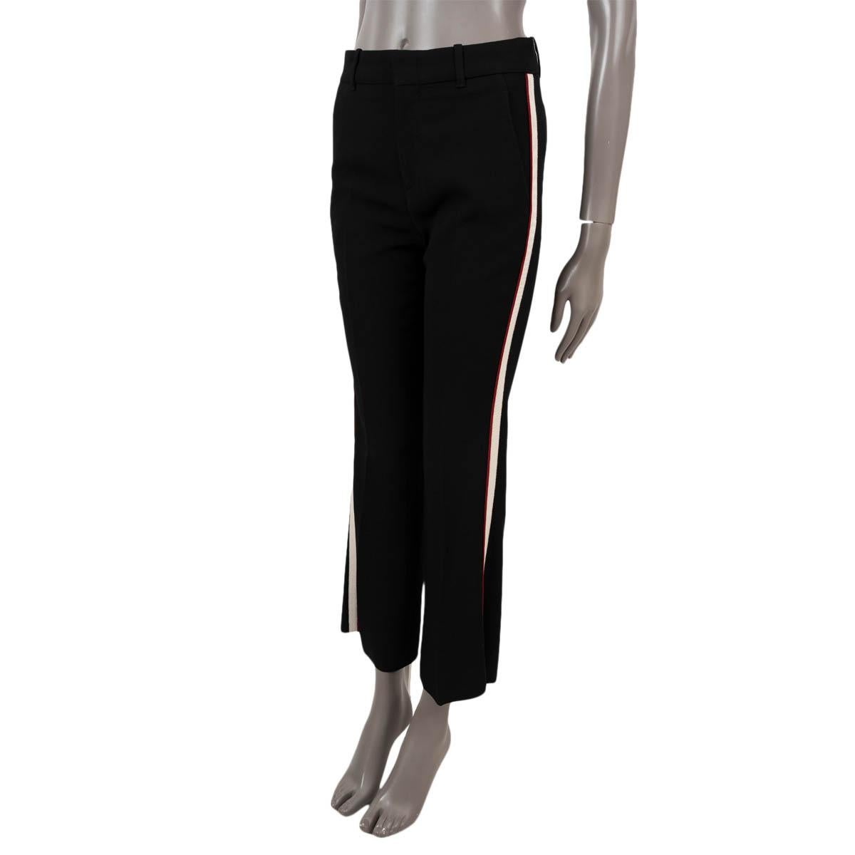 100% authentic Gucci stretch cady pants in black viscose (with 3% elastane). Features boot cut, cropped legs, ivory and red grosgrain side stripe, two slant pockets and two button back pockets. Open with a concealed hook and zipper. Has been worn