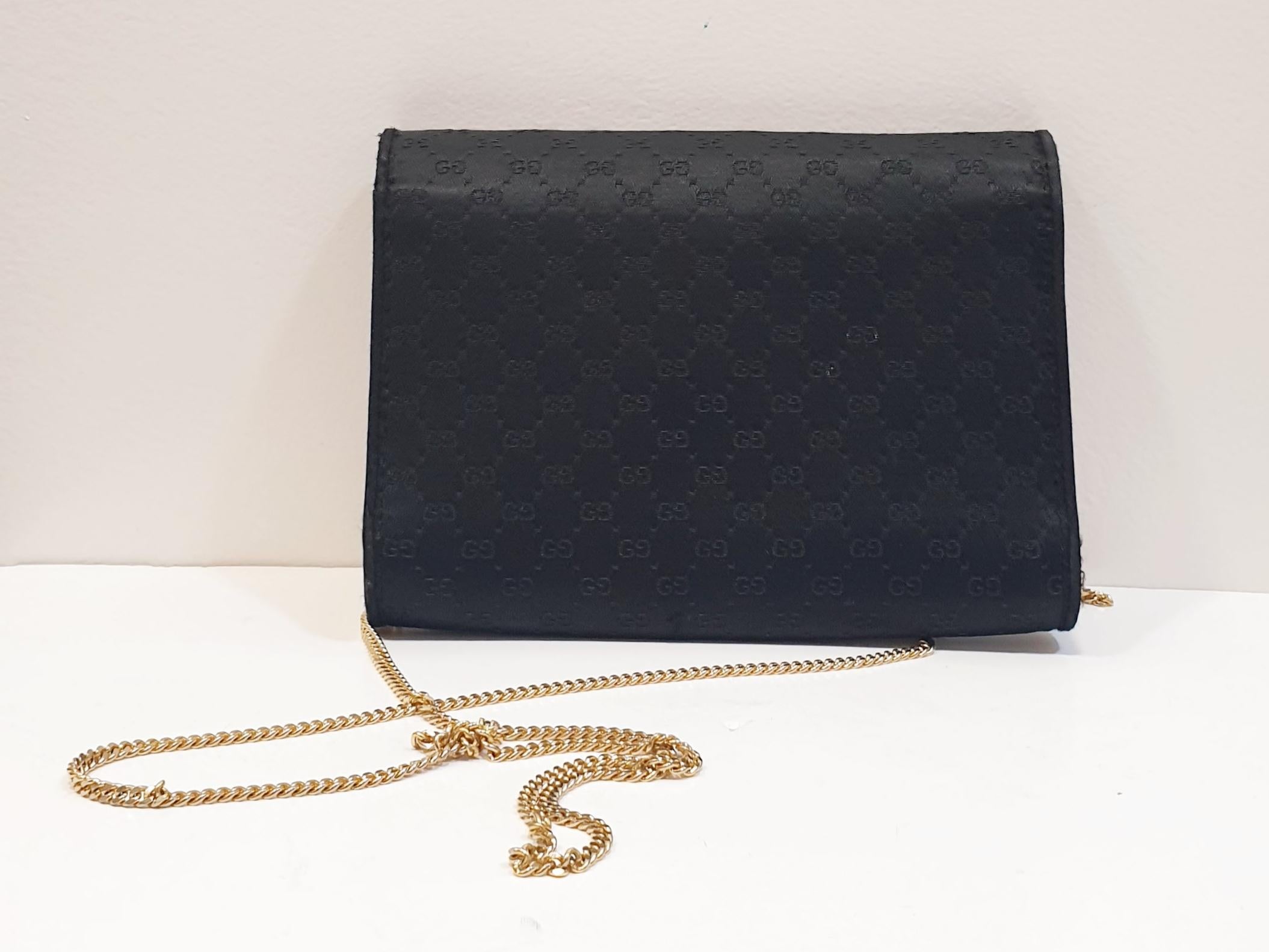 black gucci purse with gold chain