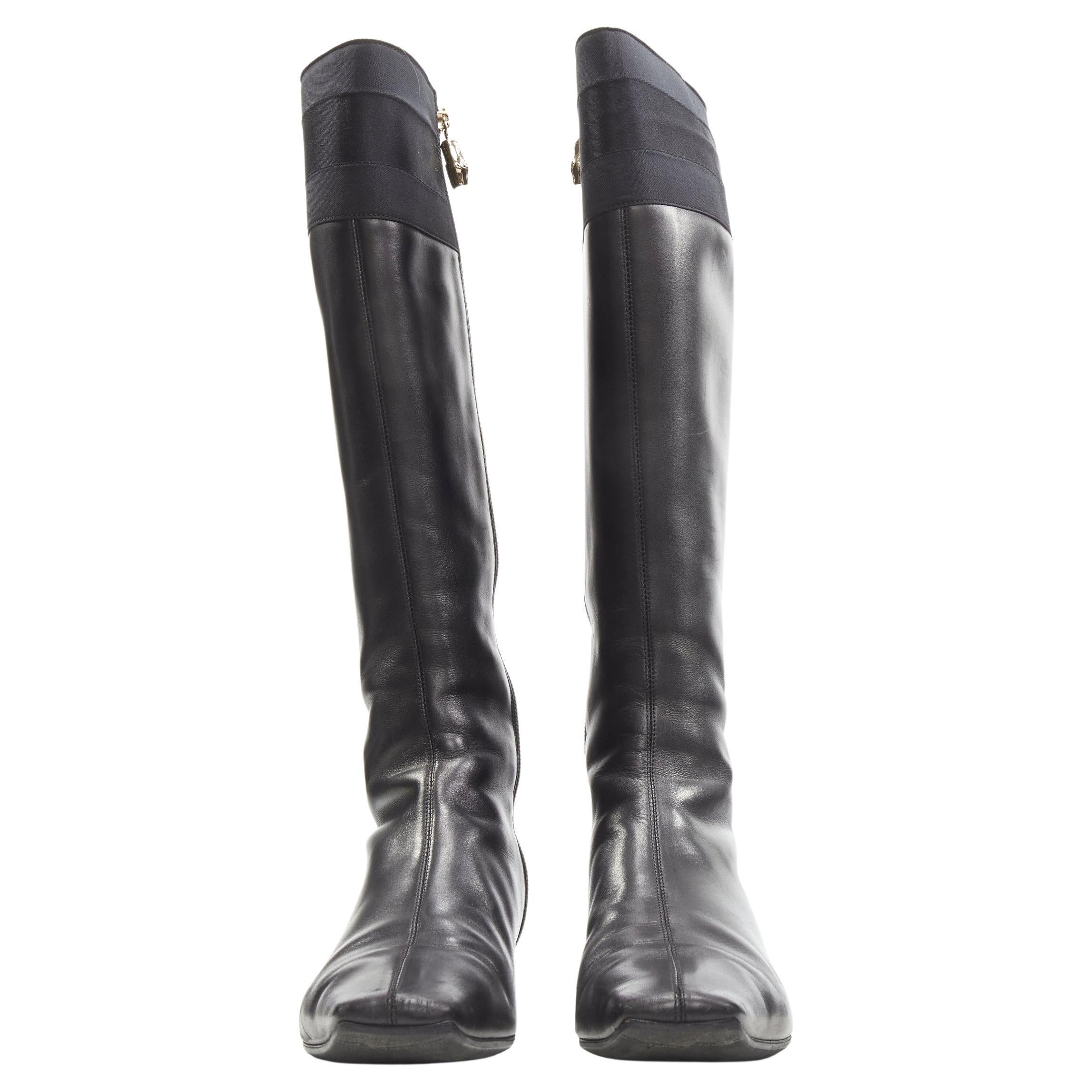 GUCCI black web trim leather gold bamboo charm zip riding boots EU36
Brand: Gucci
Material: Leather
Color: Black
Pattern: Solid
Closure: Zip
Extra Detail: Gold-tone Bamboo zipper pull. Square toe.
Made in: Italy

CONDITION:
Condition: Good, this