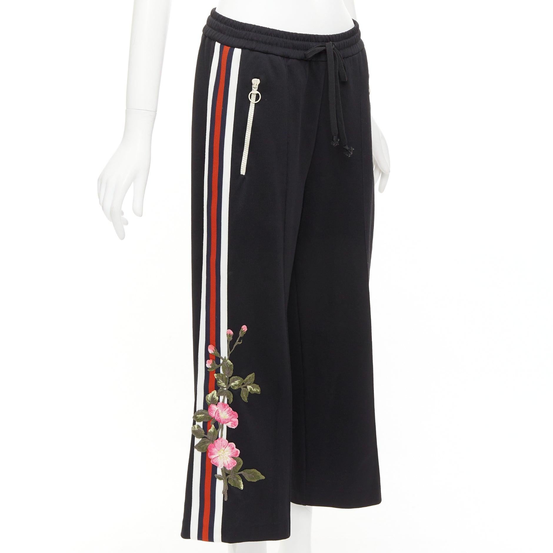 GUCCI black webbing floral patch zip pocket wide leg joggers
Reference: NKLL/A00413
Brand: Gucci
Designer: Alessandro Michele
Material: Fabric
Color: Black, Multicolour
Pattern: Floral
Closure: Elasticated
Extra Details: Zipper pockets. Floral