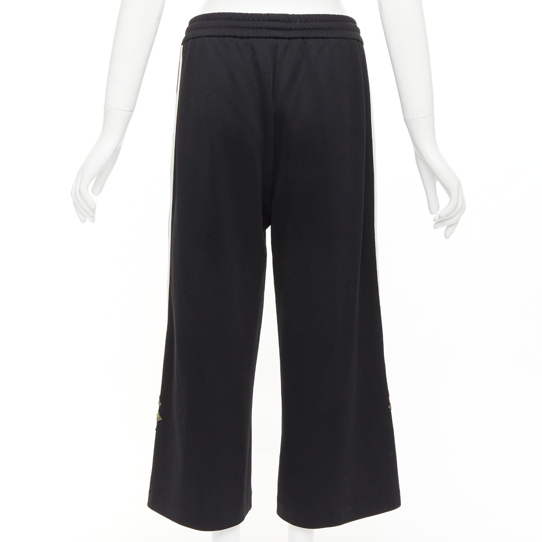 Women's GUCCI black webbing floral patch zip pocket wide leg joggers For Sale