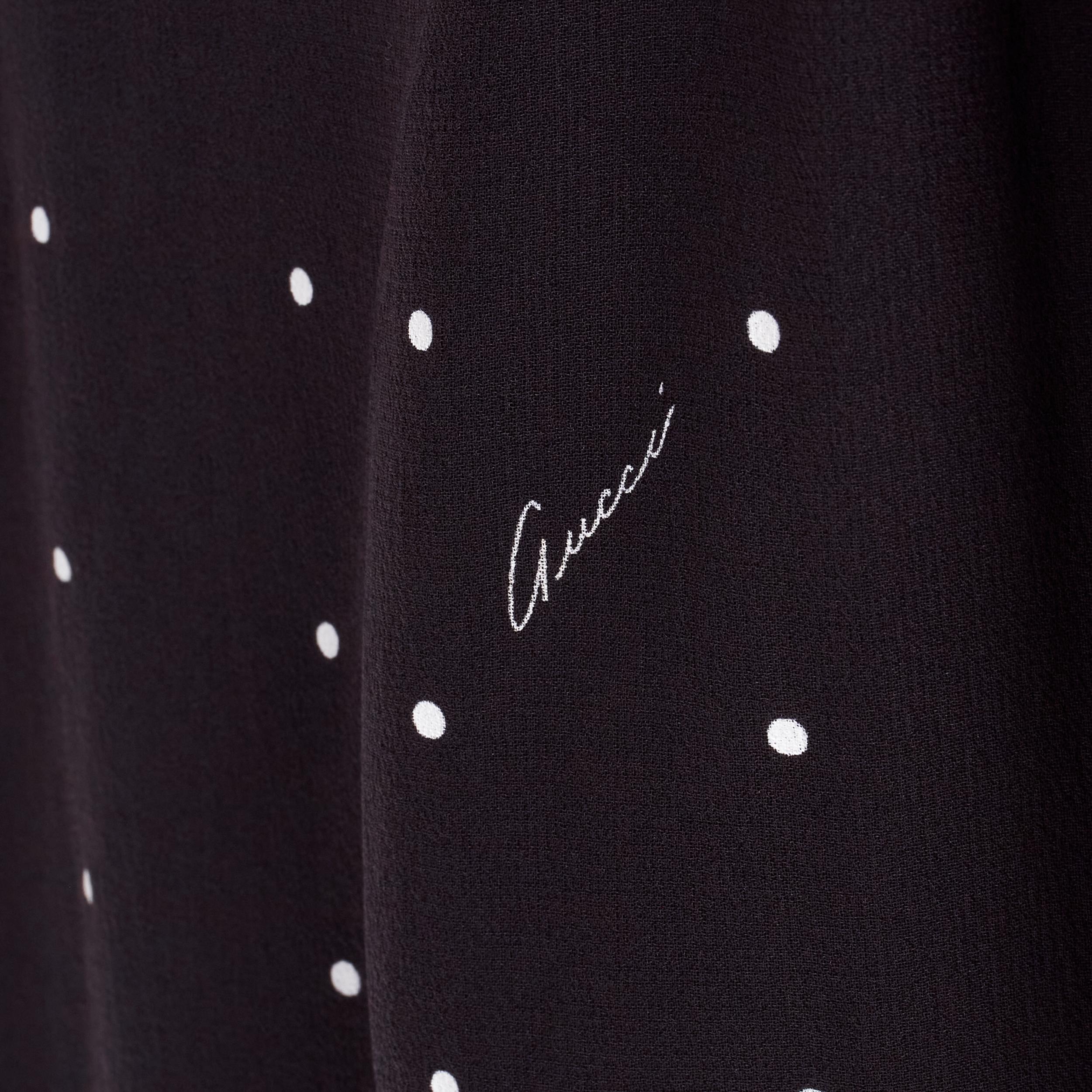 GUCCI black white polka dot cursive logo print laced front mini dress IT38 XS 
Reference: ANWU/A00652 
Brand: Gucci 
Material: Feels like silk 
Color: Black 
Pattern: Polka Dot 
Closure: Lace Front 
Extra Detail: Lace up plunge neckline. Ruched
