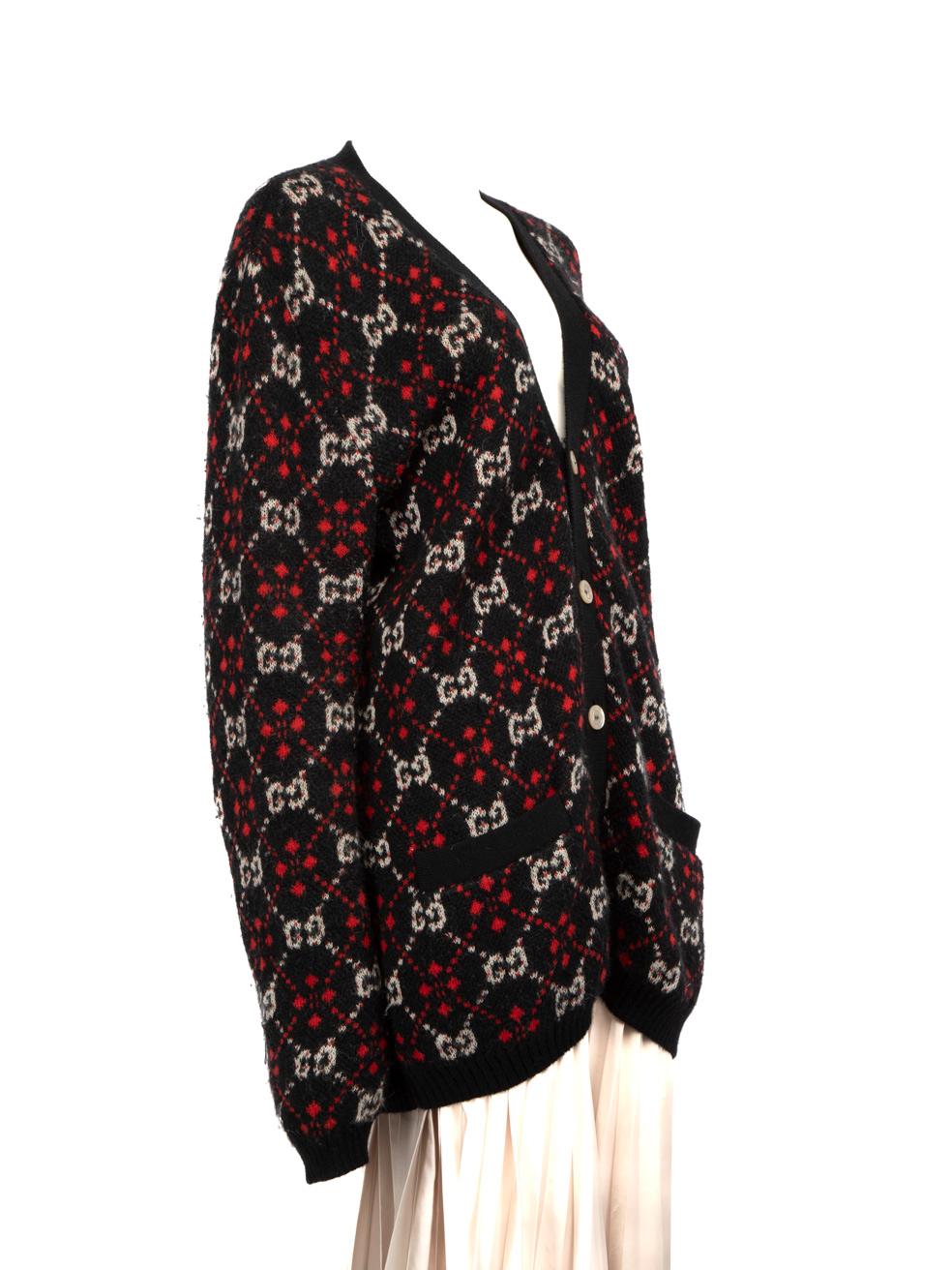 CONDITION is Good. General wear to the cardigan is evident. Moderate signs of wear to the material as pilling is evident. The tag in the neckline has discoloured and there is a mark on the right side of the neckline at the front. Pulls to the weave