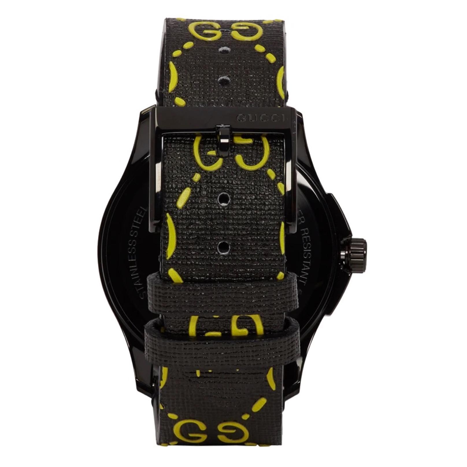 GUCCI BLACK  YELLOW G-TIMELESS GUCCI GHOST WATCH

Swiss-made stainless steel PVD-coated two-hand watch in gunmetal-tone. Lugged case. Flat sapphire crystal lens at circular face. Textured rubber dial in black featuring logo bonded in yellow. Logo